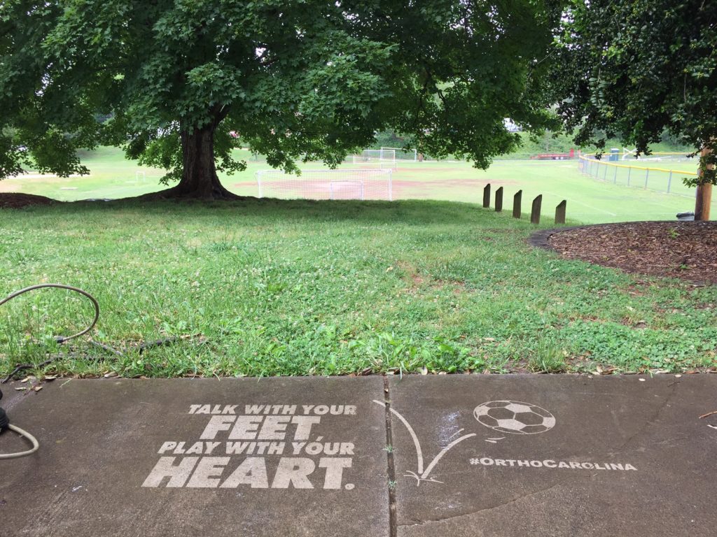 Motivational Clean Graffiti for OrthoCarolina near soccer fields in Charlotte, NC. #thesavageway
