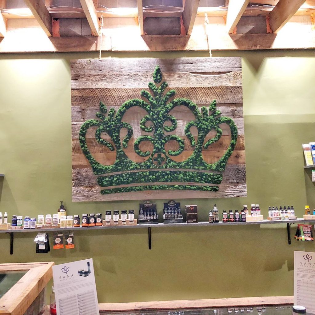 a crown made of preserved plants hangs in the shop of local retailer Charlotte CBD