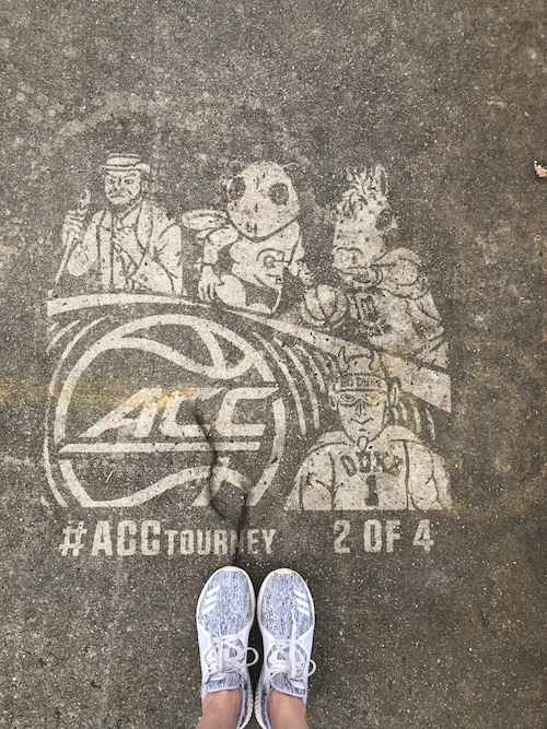 Reverse Graffiti on the sidewalk featuring detailed mascots from The ACC