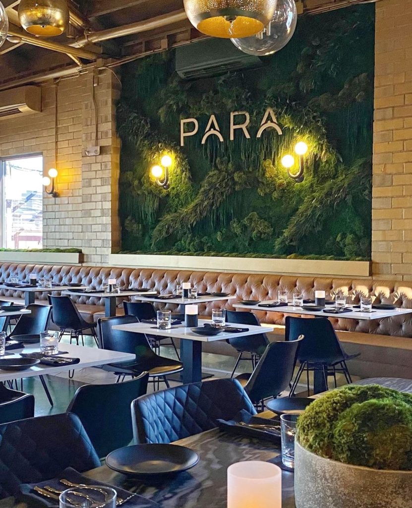 Inside view of new restaurant, Para, featuring a lush green moss wall