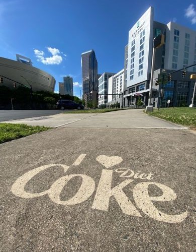 Diet_Coke_3-4 Clean Graffiti of the Diet Coke Label on a city sidewalk